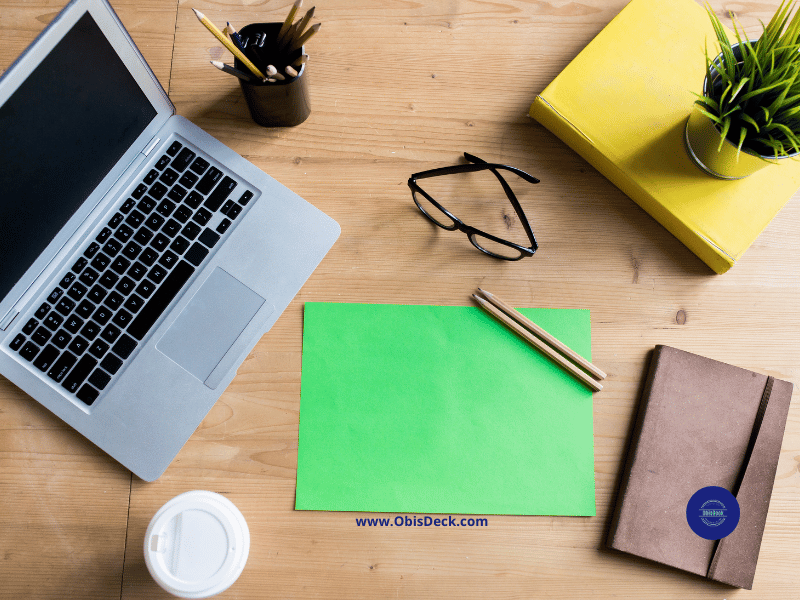 Blue-light blocking glasses placed neatly beside a laptop and coffee on a bright desk, representing digital wellness.